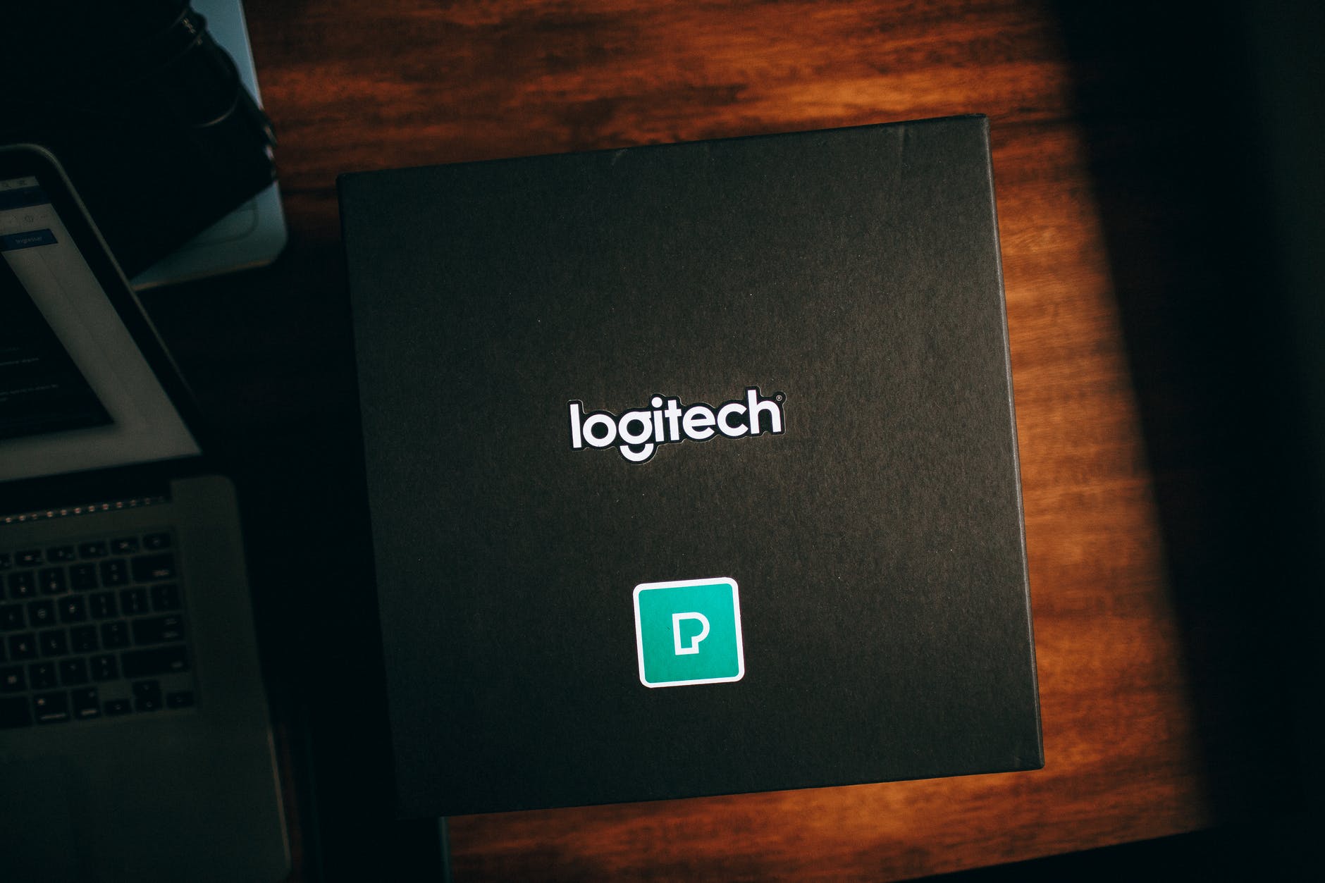 black logitech box on brown wooden table
All In One od Logitech